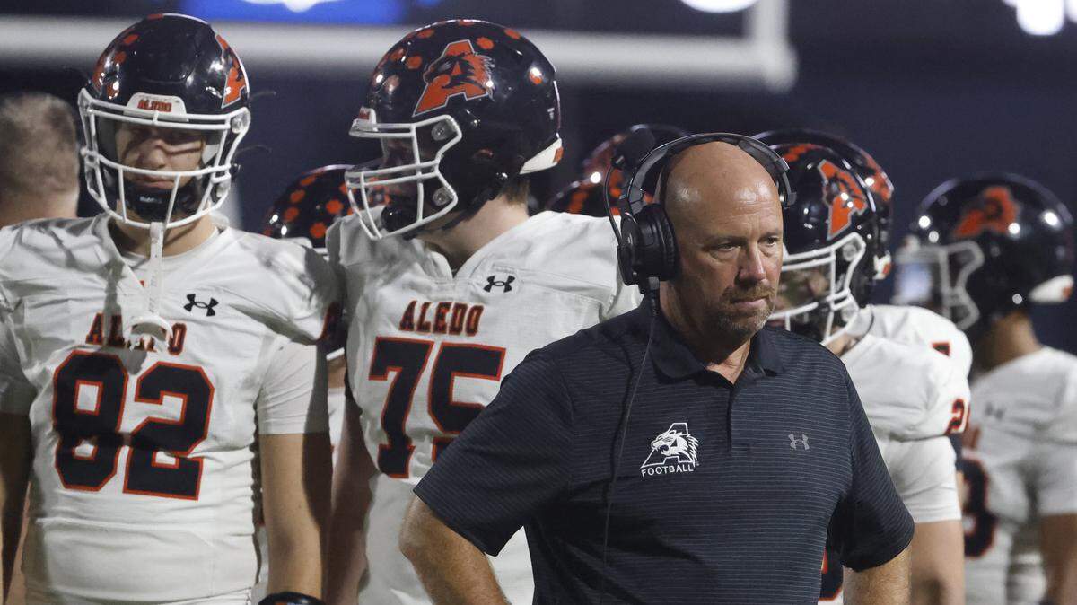 Aledo head coach Robby Jones walks off the field after a timeout during the first half of a UIL football game between against North Richland Hills Richland on Thursday, October, 23, 2025 at Birdville FAAC Stadium in North Richland Hills, Texas.