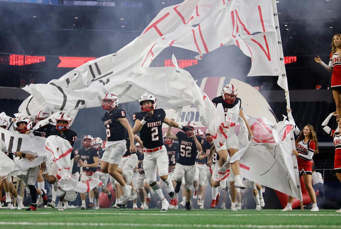 The Hornets take the field for the UIL 2A D2 State Championship football game at AT&T Stadium in Arlington, Texas, Wednesday, Dec. 18, 2024.