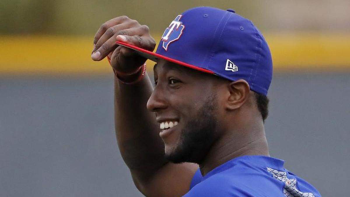Jurickson Profar went through his first spring workout with the Rangers on Friday, and beforehand said that he's glad the Rangers didn't trade him during the off-season.