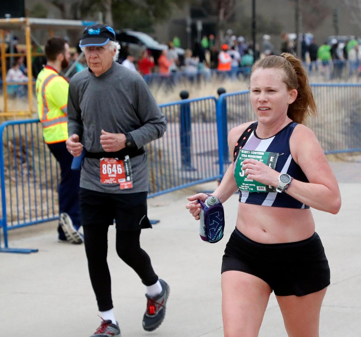 Jenna Henry passes up a half marathoner to take second in the women’s ultra marathon with a time of 3:53.45 during the 2023 Cowtown Marathon in Fort Worth, Texas, Sunday, Feb. 26, 2023. Almost 21,000 runners registered for the two day event. (Special to the Star-Telegram Bob Booth)