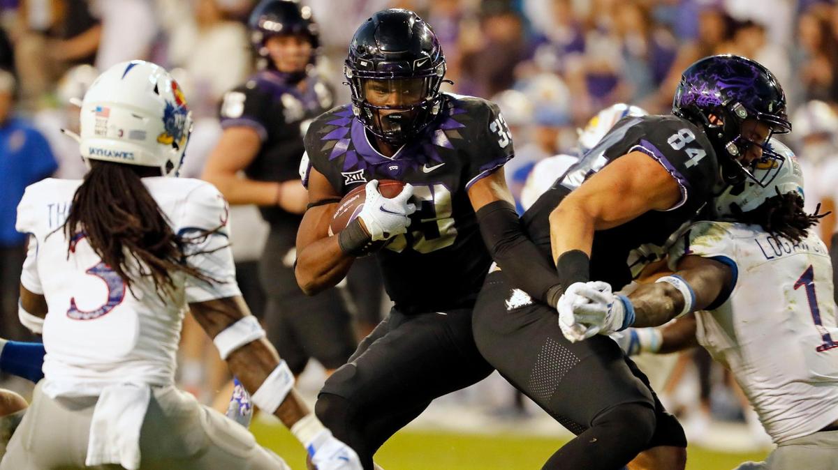 Running back Kendre Miller (33) and TCU want to keep the season alive. The Frogs can clinch a bowl berth with a victory at Iowa State on Friday.