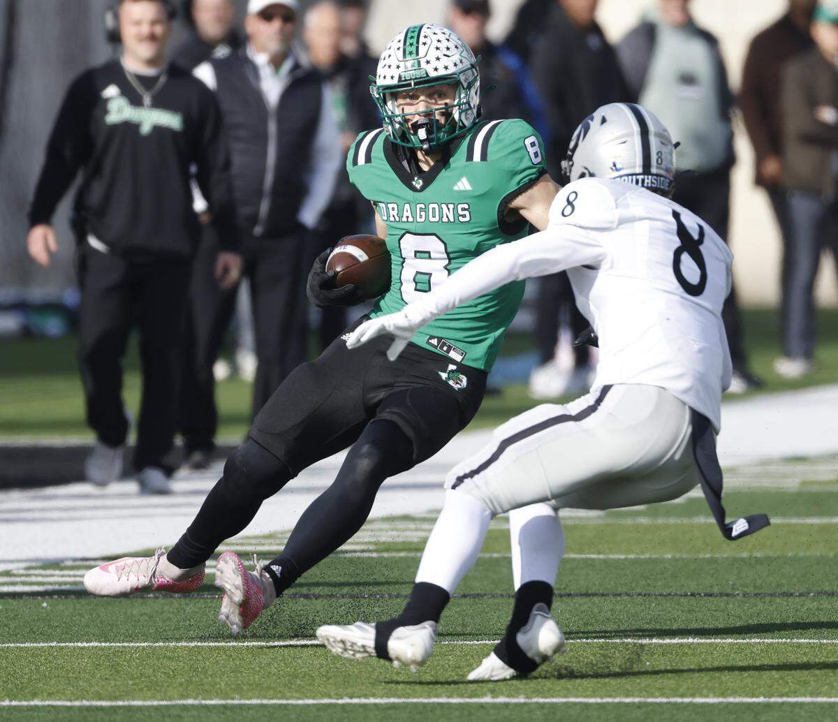 Southlake Carroll punter Zac Hays (8) is dropped by Denton Guyer defensive back Tate Caine (8) after a failed trick punt play during the first half of a UIL Class 6A Division II Quarterfinal on Saturday Dec. 06, 2025 at Crowley ISD Multi-Purpose Stadium in Fort Worth, Texas.