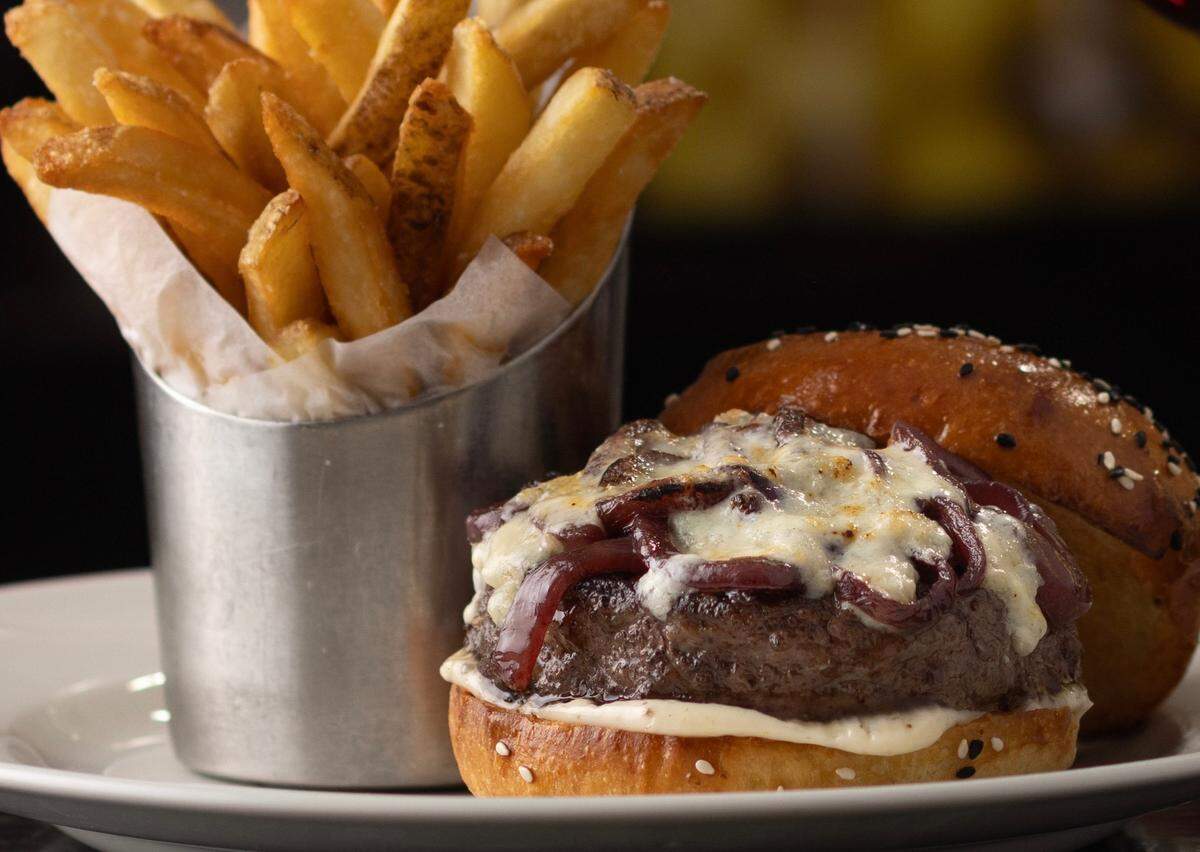 The blue cheese-black truffle burger at Capital Grille locations.
