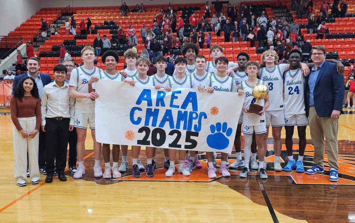 The Krum Bobcats pose with the area-round trophy after defeating Glen Rose in a Class 4A Division 2 game on Thursday, February 20, 2025 at Aledo High School in Aledo, Texas.