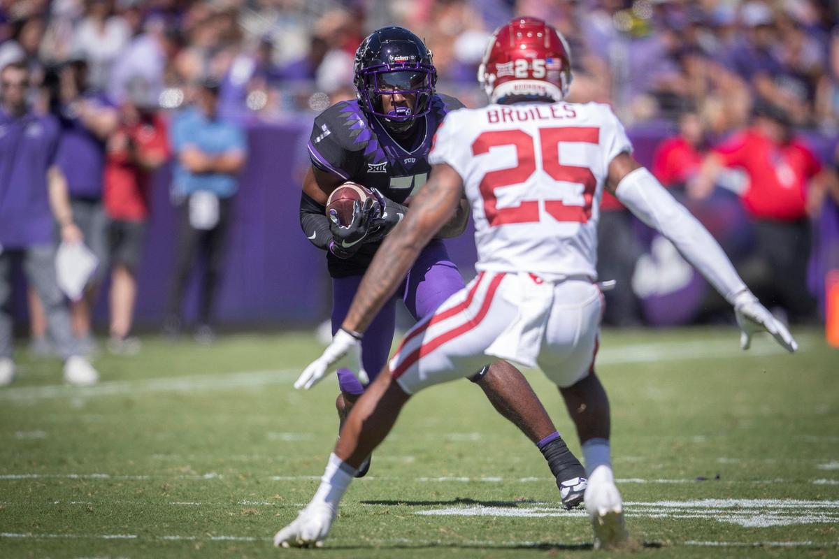 TCU wide receiver Jordan Hudson drives the ball down the field against OU safety Justin Broiles at the Amon G. Carter Stadium in Fort Worth, Texas, on Saturday, Oct. 1, 2022.