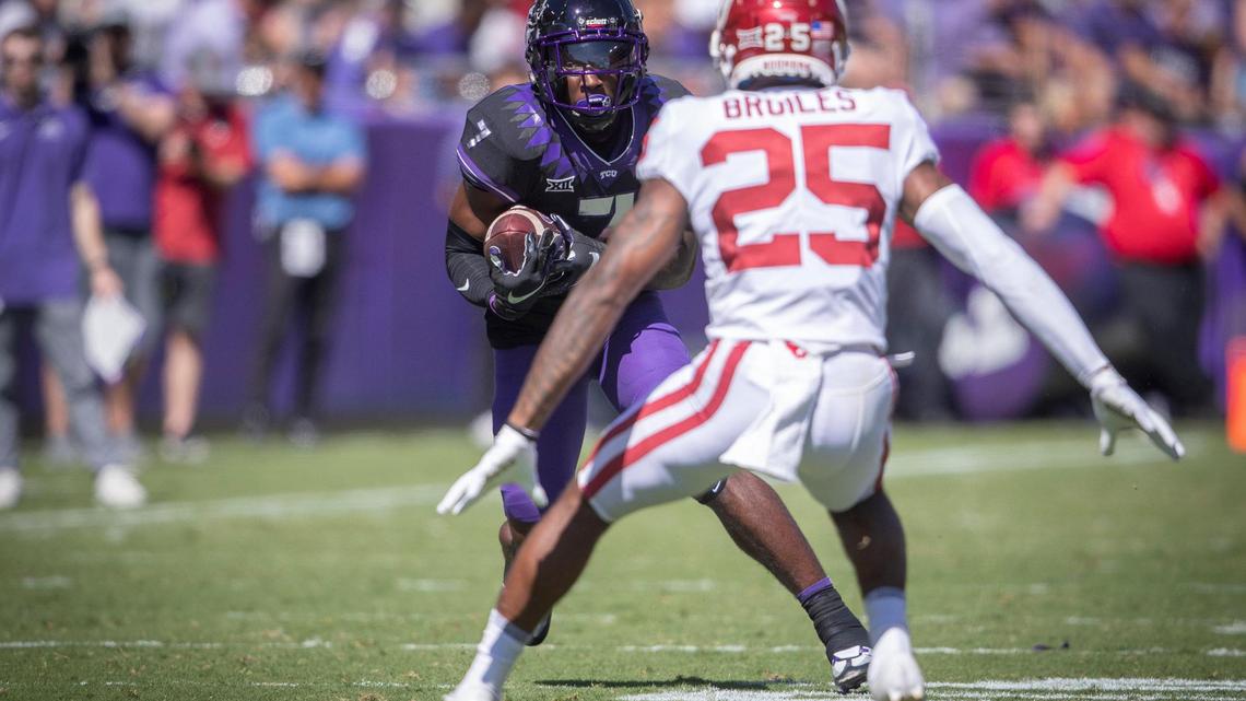 TCU wide receiver Jordan Hudson drives the ball down the field against OU safety Justin Broiles at the Amon G. Carter Stadium in Fort Worth, Texas, on Saturday, Oct. 1, 2022. Hudson signed a NIL deal with Revival Fitness Texas on Nov. 15, 2022.