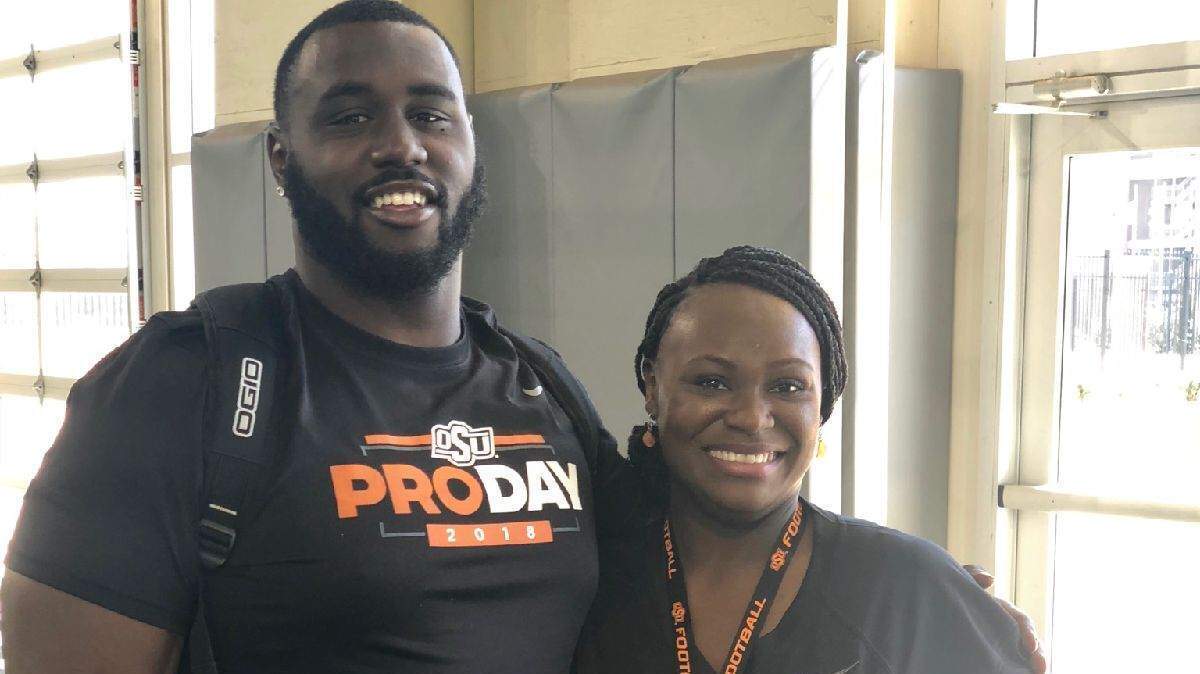 Former Oklahoma State and South Grand Prairie star defensive lineman DeQuinton Osborne, here with his mother Dorothy, signed with the Dallas Cowboys as an undrafted rookie free agent. He was released by the team Wednesday.