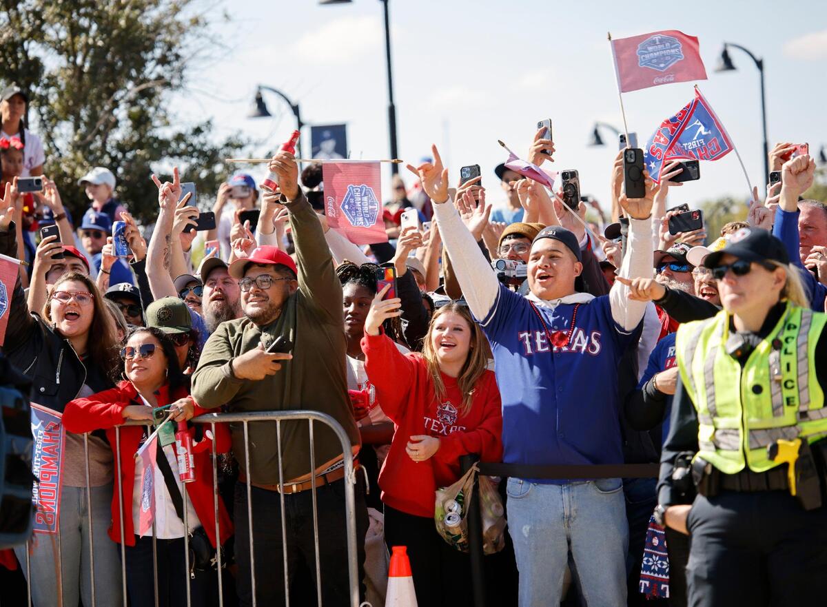 Texas Rangers fans cheer as the members of the team pass by during the Texas Rangers World Series Parade in Arlington, Texas, Friday, Nov. 03, 2023. (Special to the Star-Telegram Bob Booth)