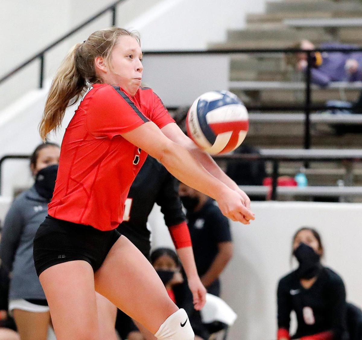Martin’s Kensie Mundell sets the ball during a high school volleyball match at Martin High School in Arlington, Texas, Tuesday, Sept. 29, 2020. Martin Lady Warriors defeated the Granbury Lady Pirates in three straight sets. (Special to the Star-Telegram Bob Booth)