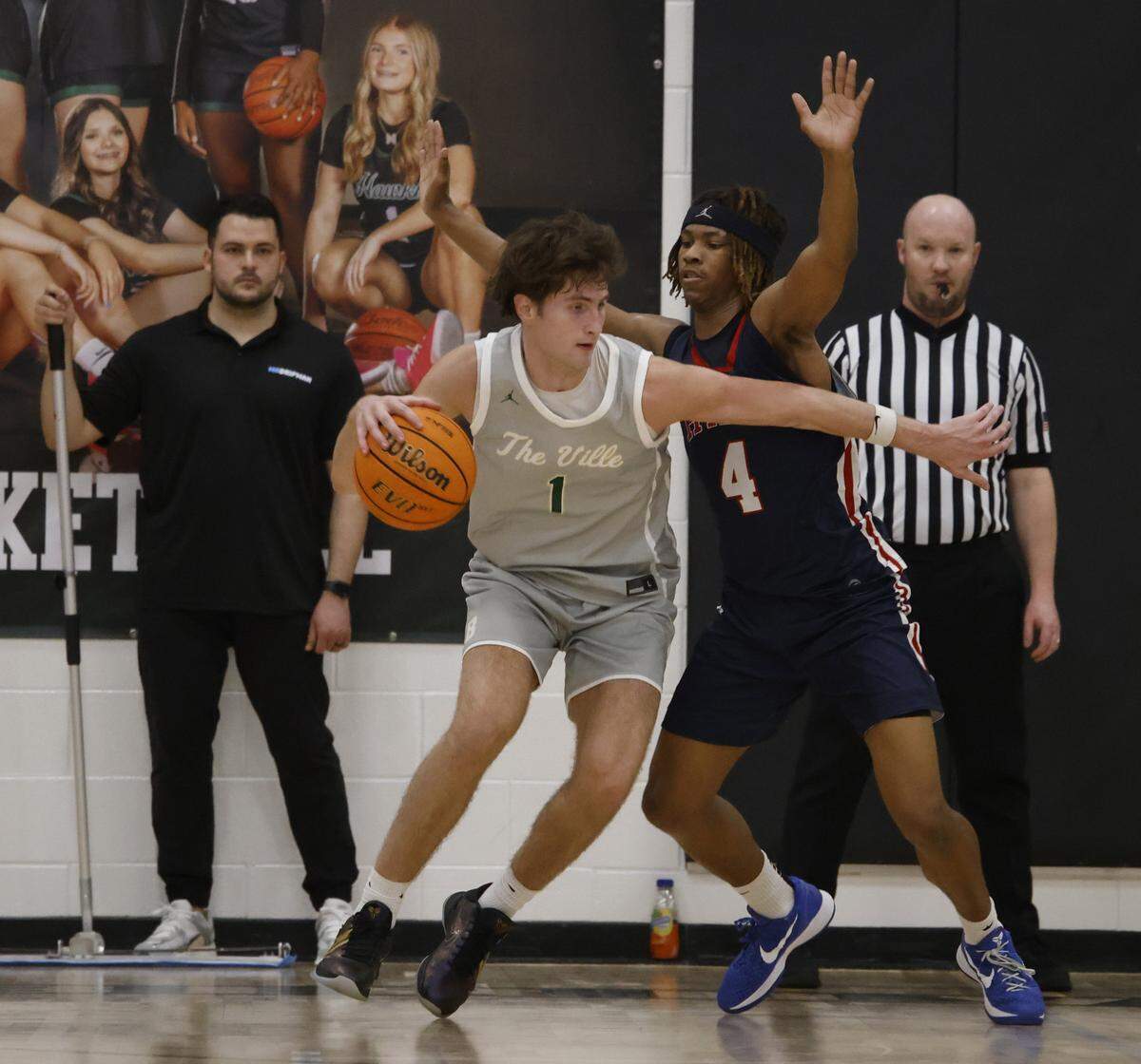 Birdville forward Sawyer Dotson (1) works against Denton Ryan forward Demichael Brooks (4) during the first half of a UIL basketball game at Birdville High School in North Richland Hills, Texas, Tuesday Feb. 17, 2026.