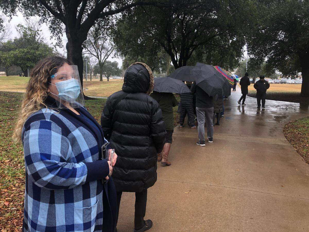Amanda Jimenez from Euless said the weather caught her by surprise as she stepped into line to receive her COVID-19 vaccine in Tarrant County. The 35-year-old works at a hospice company. 
