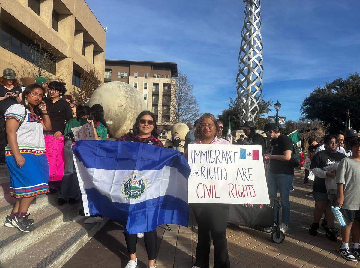 Teresita Merino (left) and Yenis Andrade (right) were outside Arlington City Hall on Sunday, Feb. 2, 2025, to protest against President Trump’s mass deportation.