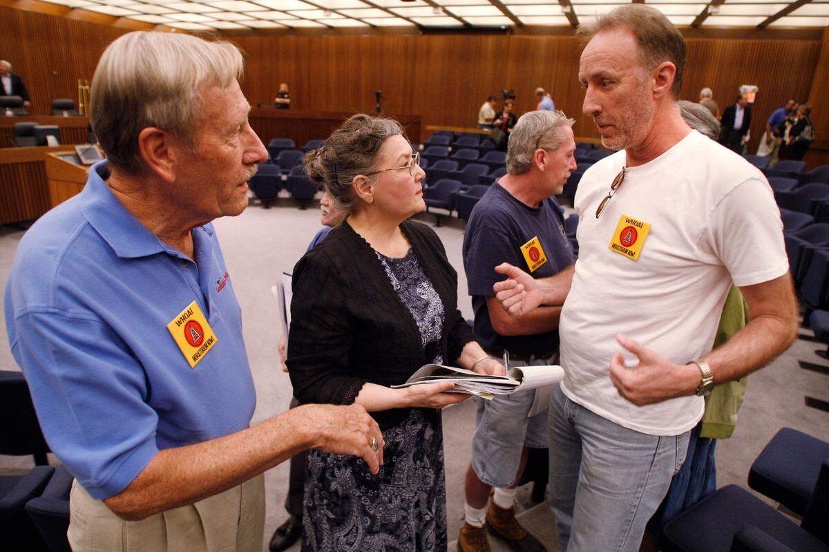 2008: Fort Worth residents Clyde Picht, left, Ann Williams and Mike Phipps talk after a gas drilling task force public hearing at City Hall