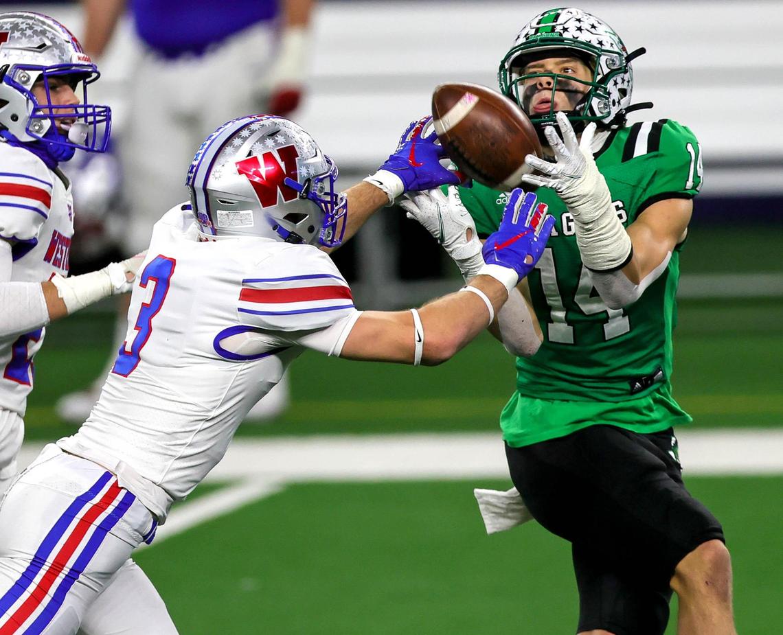 Southlake Carroll receiver Brady Boyd (14) come up with a nice catch against Austin Westlake defensive back Lucas Mireur (3) during the second half of the 6A Division 1 High School State Championship football playoff game, January 16, 2021 played at AT&T Stadium in Arlington, Tx. (Steve Nurenberg Special to the Star-Telegram)