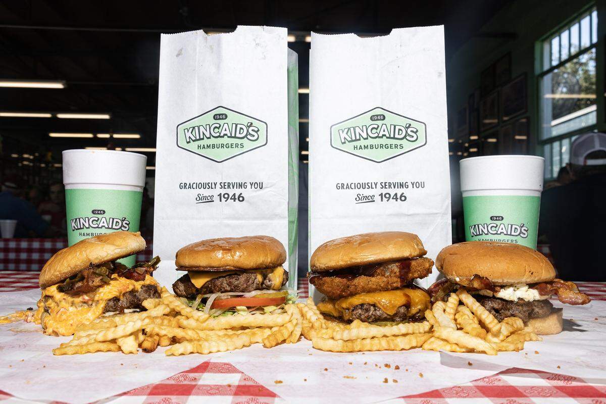The Cowtown Deluxe burger, Cheeseburger, Cattleman burger, and Texas Firecracker burger at Kincaid's Hamburgers in Fort Worth on Friday, Oct. 17, 2025. Kincaid's is the winner of the Fort Worth Star-Telegram Readers Choice poll for best burgers in the city.