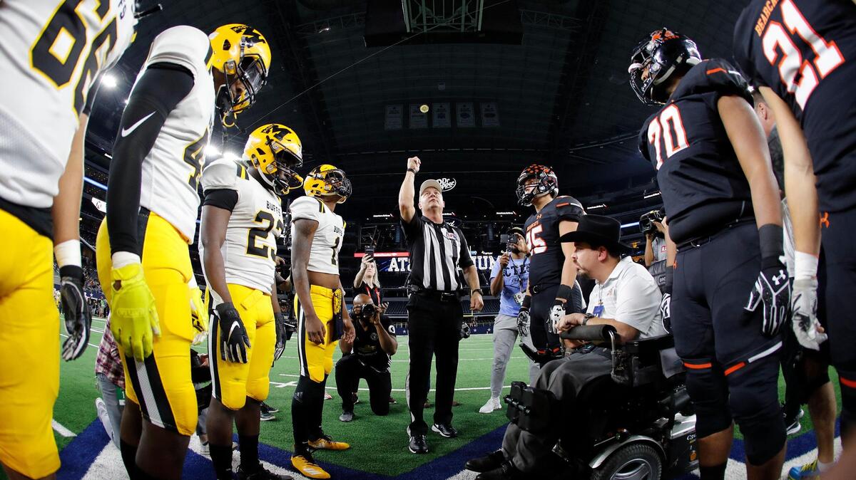 Fort Bend Marshall and Aledo take the coin toss to start the first half of a Texas High School 5A Division II State Championship football game at AT&T Stadium, Arlington, Texas, Friday, Dec. 21, 2018. Aledo led 28-12 at the half. (Star-Telegram Bob Booth)