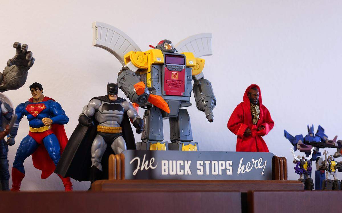 Immigration attorney Jaime Barron keeps many items of inspiration at his Dallas office as seen on Wednesday, Jan. 14, 2026. Barron said the Transformers character Omega Supreme, center, is his favorite due to his role as a protector of cities.