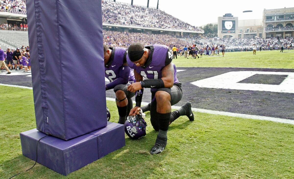 TCU Horned Frogs quarterback Trevone Boykin (2) and linebacker Paul Dawson (47) say a prayer at the goalpost before the game. The Texas Christian University Horned Frogs beat the Southern Methodist Mustangs, 48-17, in their annual Iron Skillet game in Fort Worth, Texas, Saturday, September 28, 2013.