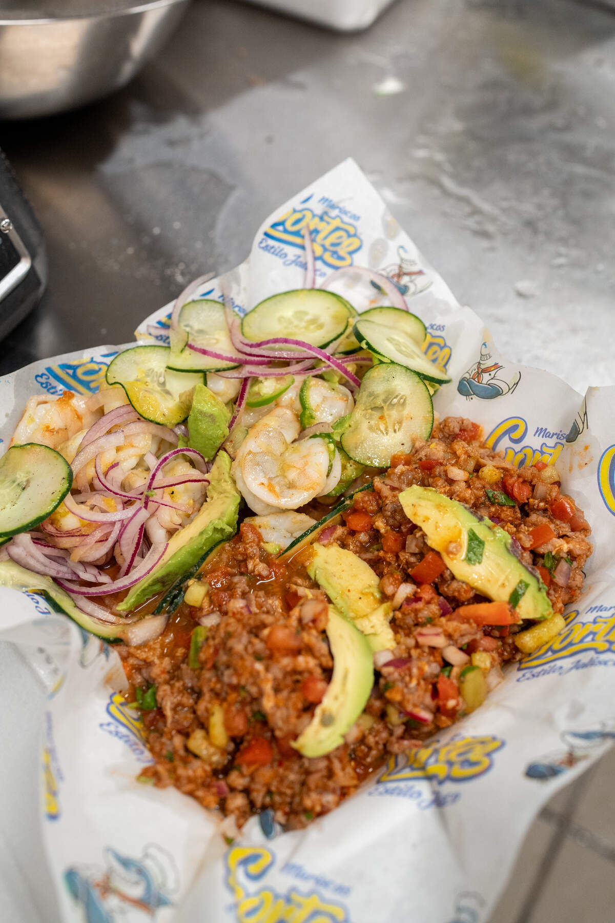 Ceviche at Mariscos Cortez comes with choices of shrimp or tilapia in spicy or non-spicy with onion, tomato, cucumber and serranos with tostadas.