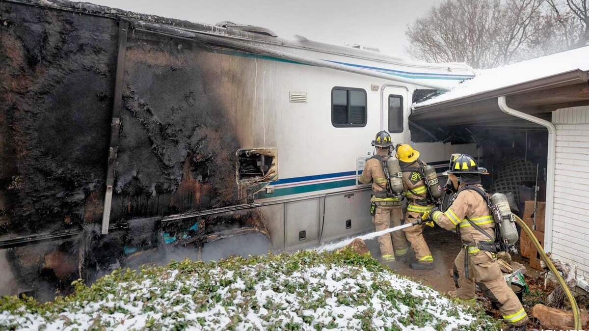 Fort Worth firefighters battle a 1-alarm blaze in the 6000 block of Wrigley Way after an RV collided with a house.