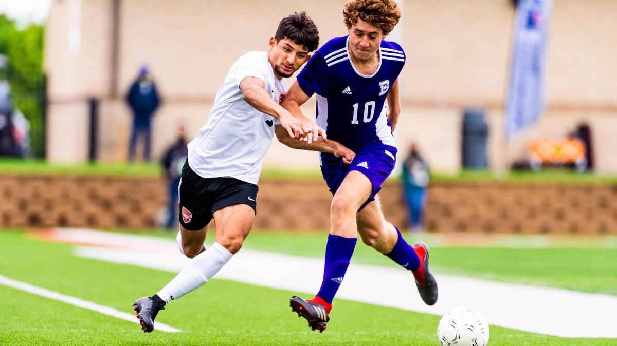 Luis James (left) and Joe Ballenger (10) fight for the ball during the 4A state final between Fort Worth Diamond Hill-Jarvis and Boerne at Birkelbach Field in Georgetown Texas, on April 17th 2021. Photo by Matt Smith (Special to the Star-Telegram).