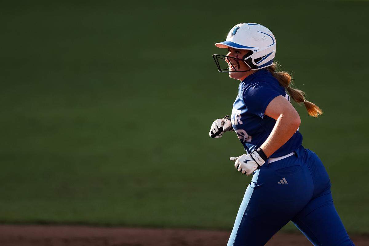 White Settlement Brewer first baseman Kamren Pride (18) smiles toward her teammates after hitting a home run against Montgomery Lake Creek in the UIL Class 5A Division II state softball championship game at Red & Charline McCombs field in Austin, Texas, on Friday, May 29, 2026.
