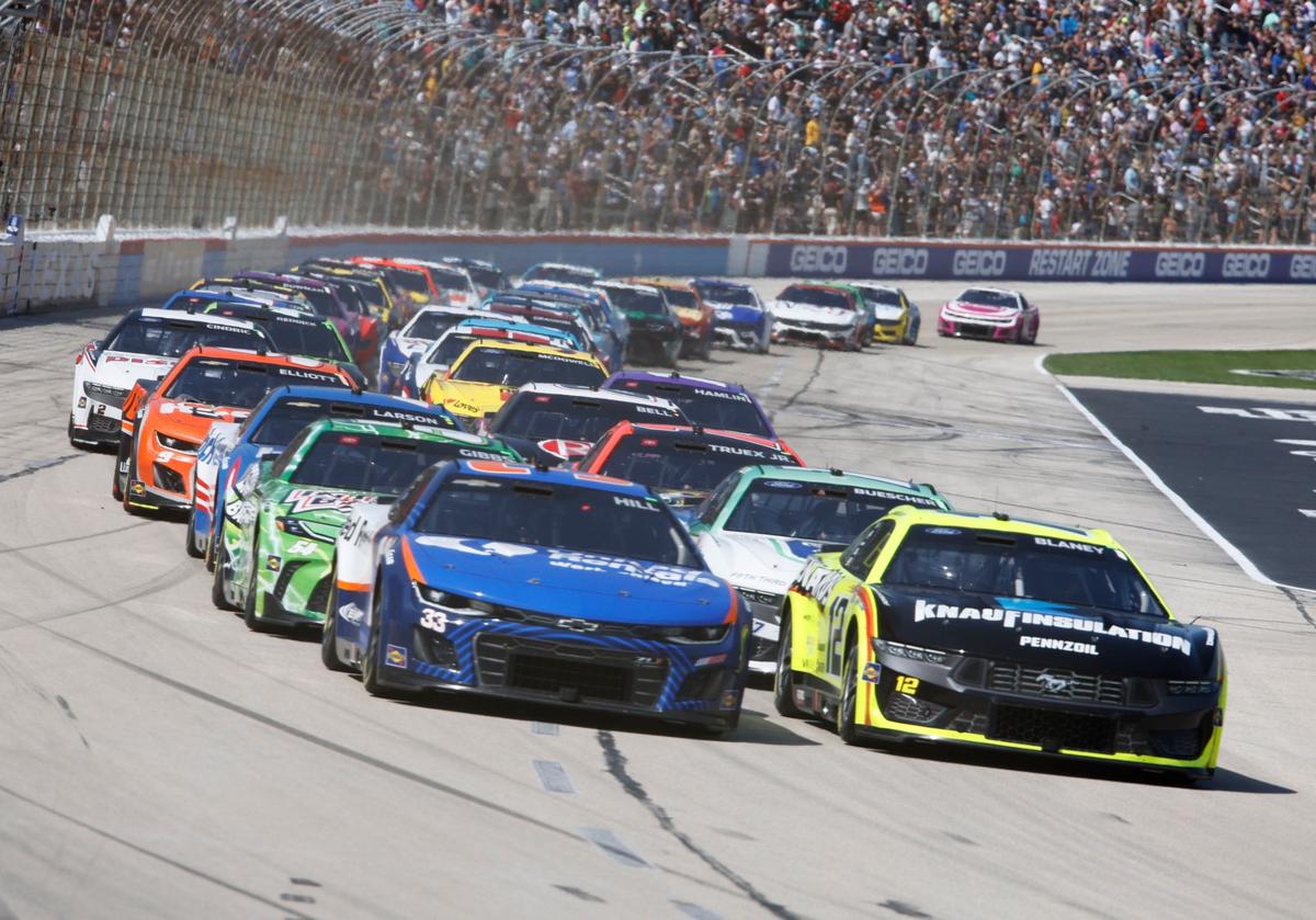 Austin Hill (33) and Ryan Blaney (12) lead the pack past the green flag at the start of Stage 2 of the Auto Trader Echo Park 400 at Texas Motor Speedway in Fort Worth, Texas, April 14, 2024. Kyle Larson won stage 1. (Special to the Star-Telegram/Bob Booth)