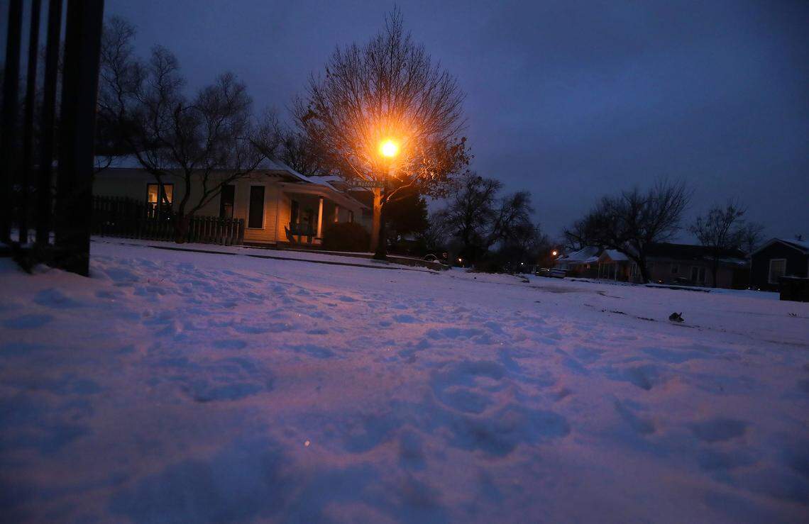 Dusk settles over the Fairmount neighborhood of Fort Worth after another cold and snowy day on Wednesday, February 17, 2021.