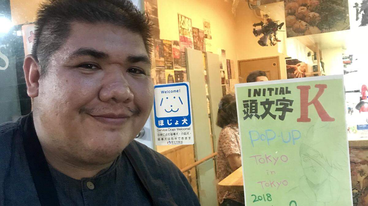 Tokyo Cafe chef Kevin Martinez with the poster for his pop-up dinner Saturday night at Uenomaru Restaurant in Nakano, a neighborhood in Tokyo.