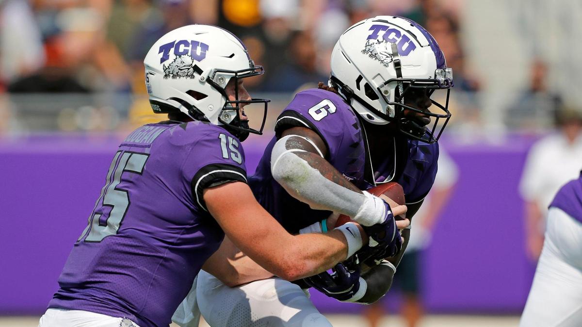TCU quarterback Max Duggan (15) hands the ball to running back Zach Evans (6) in the first half of a NCAA college football game in Fort Worth, Texas, Saturday, Sept. 11, 2021. Cal led by five at the half. (Special to the Star-Telegram Bob Booth)