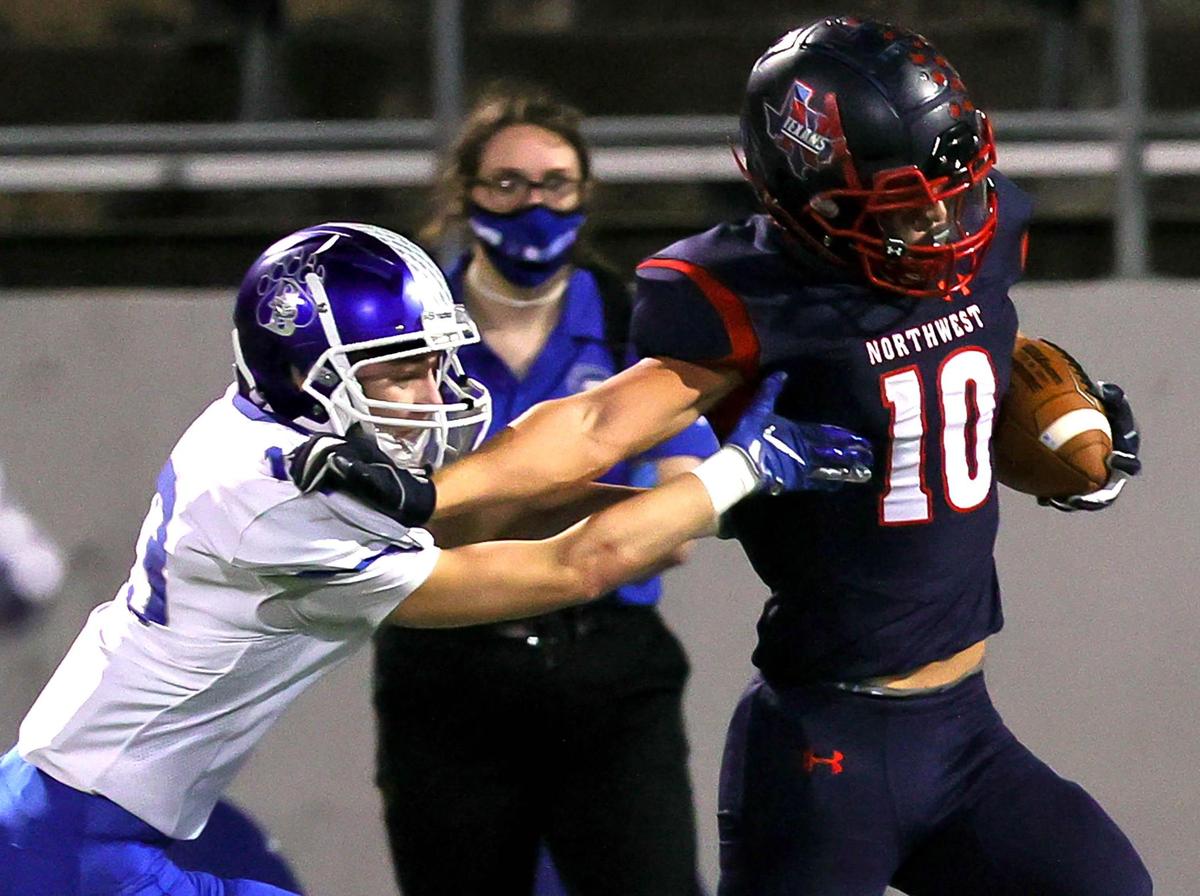 Northwest running back Kyndel Sims (10) tries to get past Brewer defensive back Collin Hayes (13) during the first half of a high school football game, November 19, 2020 played at Northwest ISD Stadium in Justin, Tx. (Steve Nurenberg Special to the Star-Telegram)