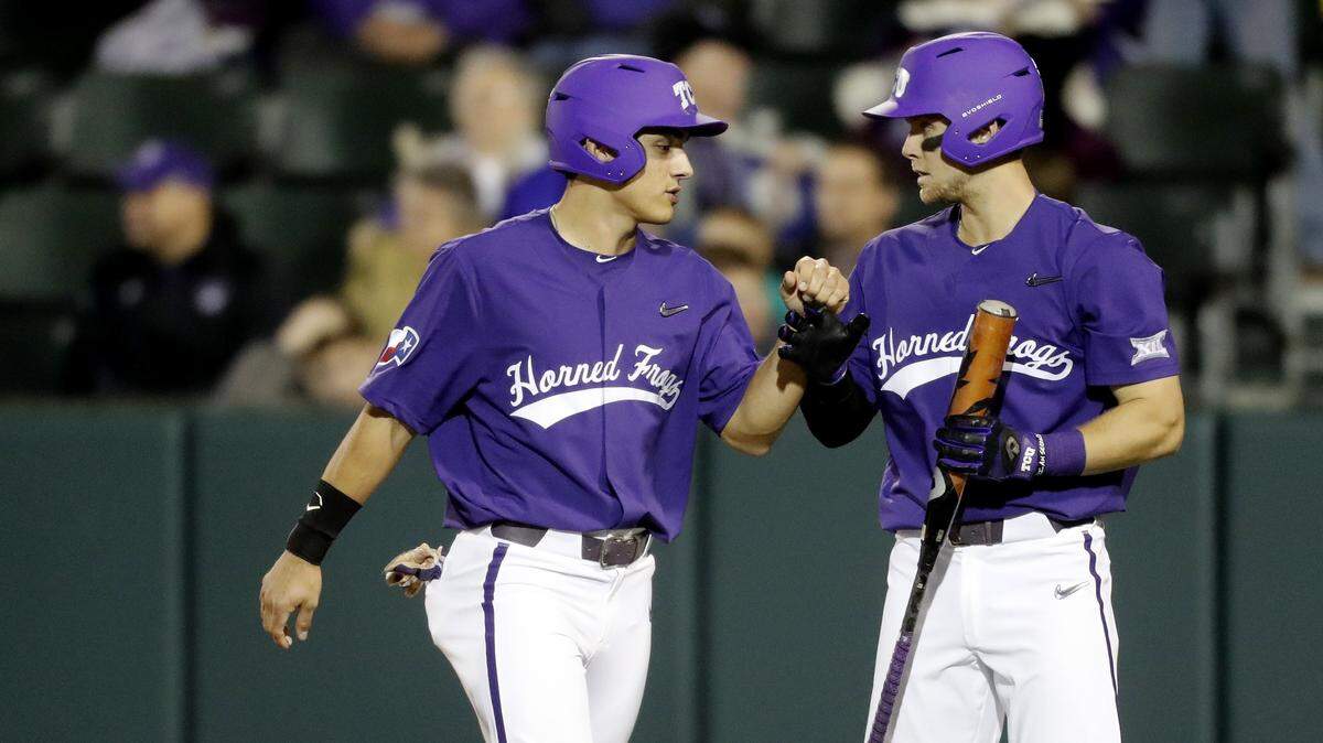 TCU center fielder Johnny Rizer (4) is congratulated by short stop  Hunter Wolfe (6) after Rizer scored TCU’s first run batted in by third baseman  Bobby Goodloe (18) during a NCAA college baseball game at Lupton Stadium in Fort Worth, Texas, Wednesday, Feb. 20, 2019. TCU led 6-3 after four innings. (Star-Telegram Bob Booth)