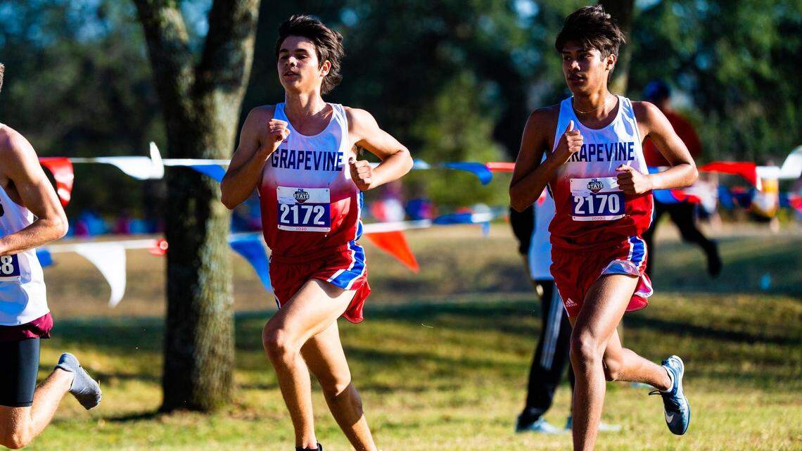 Grapevine’s Trey Leathers, left, and Josue Granados helped the Mustangs win the 5A state cross country title on Monday Nov. 23, 2020 in Round Rock.