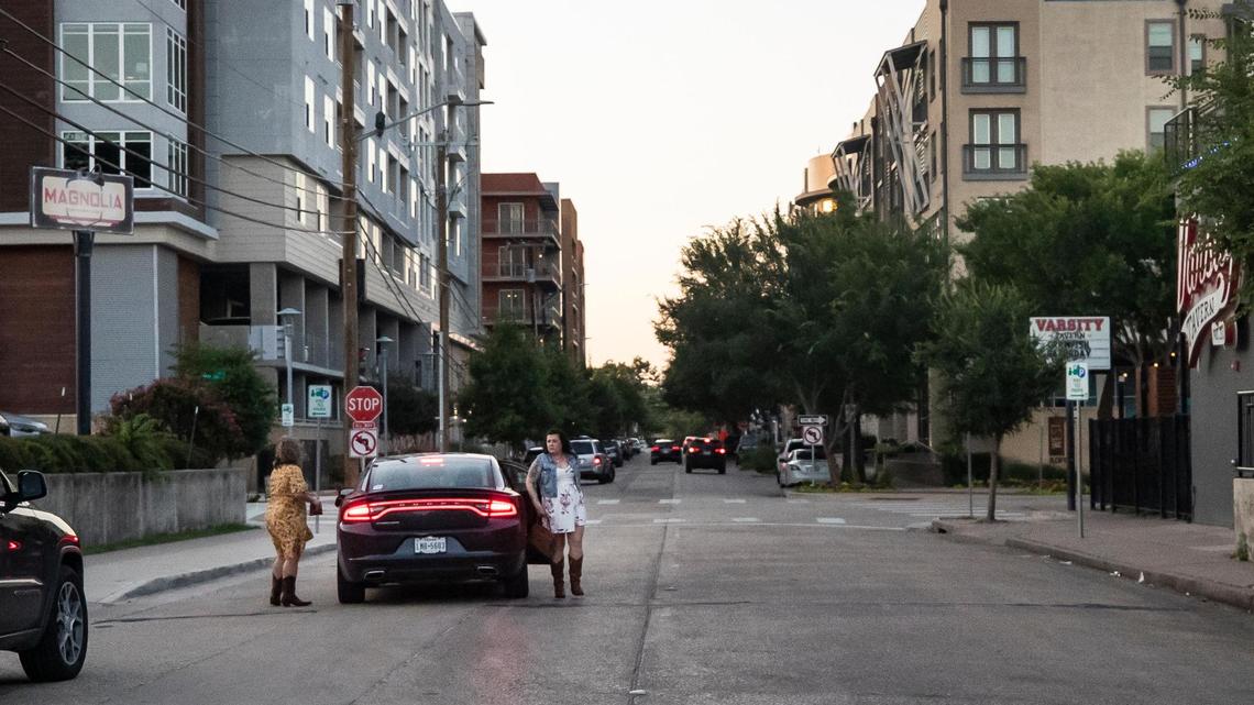 Melissa Hollingsworth and Shandra Jaquith get out of an Uber vehicle as they arrive at Magnolia Motor Lounge in Fort Worth’s West 7th area.