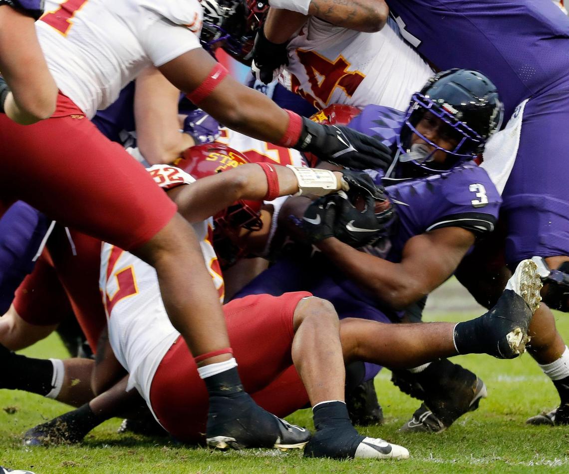 TCU running back Emari Demercado (3) gets some tough yards up the middle in the first half of a NCAA football game at Amon G. Carter Stadium in Fort Worth, Texas, Saturday, Nov. 26, 2022. TCU led 34-7 at the half. (Special to the Star-Telegram Bob Booth)