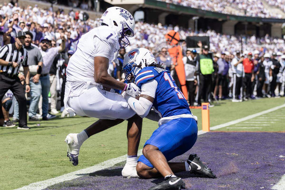SMU cornerback Jaelyn Davis-Robertson (13) intercepts a pass from TCU quarterback Josh Hoover (10) intended for wide recevier Eric McAlister (1) in the first half of an NCAA football game between TCU and SMU at Amon G. Carter Stadium in Fort Worth on Saturday, Sept. 20, 2025.