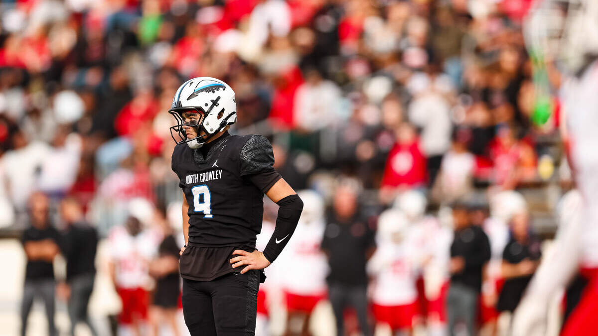 North Crowley quarterback Hayes Cloutier stares toward his sideline while driving against Coppell in a Class 6A Division I regional playoff Saturday, Nov. 29, 2025, at Midlothian ISD Stadium in Midlothian.
