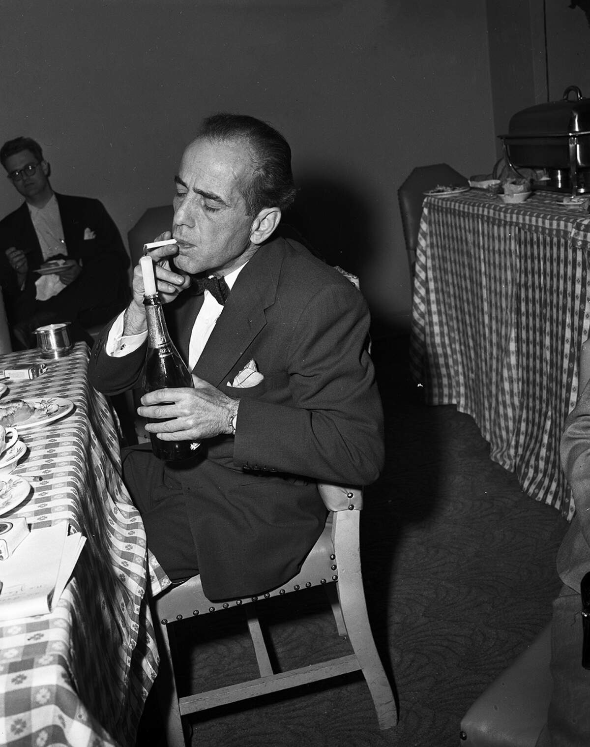 April 14, 1952: Humphrey Bogart, Academy Award winning actor, lighting a cigarette in Fort Worth.