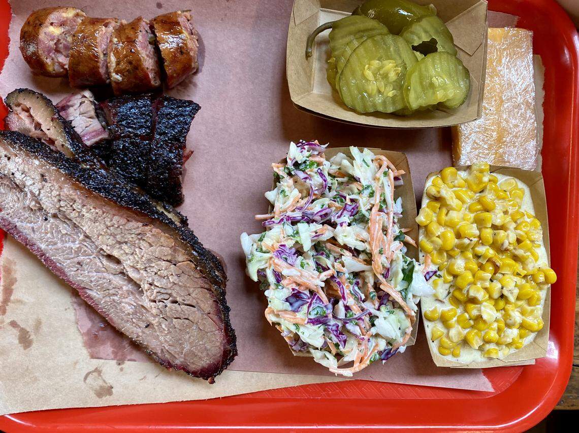 Brisket and sausage with slaw and creamed corn at Terry Black’s Barbecue.