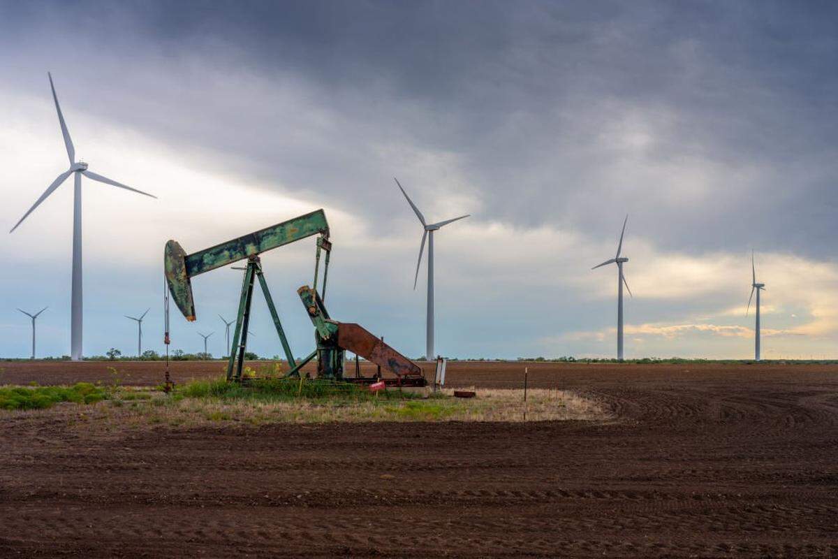 NOLAN, TEXAS - OCTOBER 04: An oil pumpjack is seen near a field of wind turbines on October 04, 2023 in Nolan, Texas. The U.S. oil industry is headed towards a record-breaking year as analysts expect the crude market to continue climbing despite minor slowing. (Photo by Brandon Bell/Getty Images)