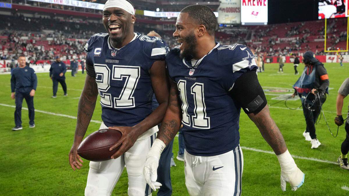 Dallas Cowboys linebacker Micah Parsons (11) shares a laugh with Dallas Cowboys defensive tackle Osa Odighizuwa (97) following a wild card NFL football playoff game against the Tampa Bay Buccaneers. Parsons will be at a charity event on Wednesday working with a burger chain.