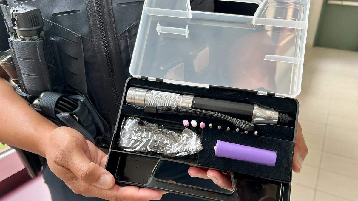 Bedford Officer Deidre Spears displays a catalytic converter theft prevention kit.