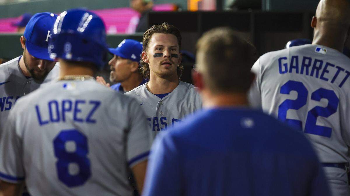 Kansas City Royals shortstop Bobby Witt Jr. (7) celebrates with teammates after scoring during the eighth inning against the Texas Rangers at Globe Life Field.