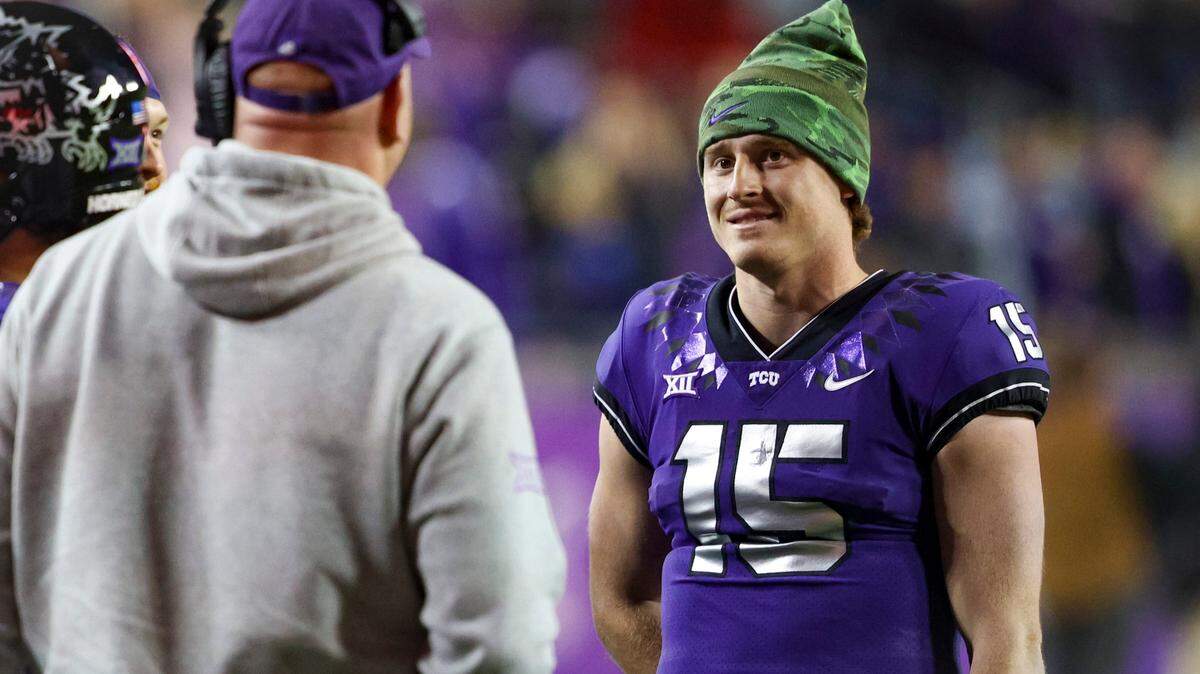 After gaining a long lead against Iowa State, TCU quarterback Max Duggan watches the game from the sidelines during the fourth quarter at the Amon G. Carter Stadium in Fort Worth on Saturday, Nov. 26, 2022. The Horned Frogs won, 62-14, and remained undefeated during their regular season.