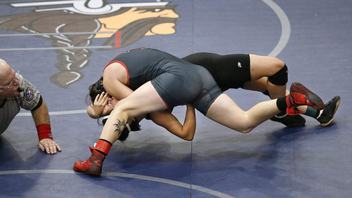 Euless Trinity transgender wrestler Mack Beggs (top) flipped and pinned South Grand Prairie's Stephania Nava in the opening seconds of the 110lb girls final of the District 5-6A wrestling meet in Irving, Texas, Saturday, Feb. 10, 2017.