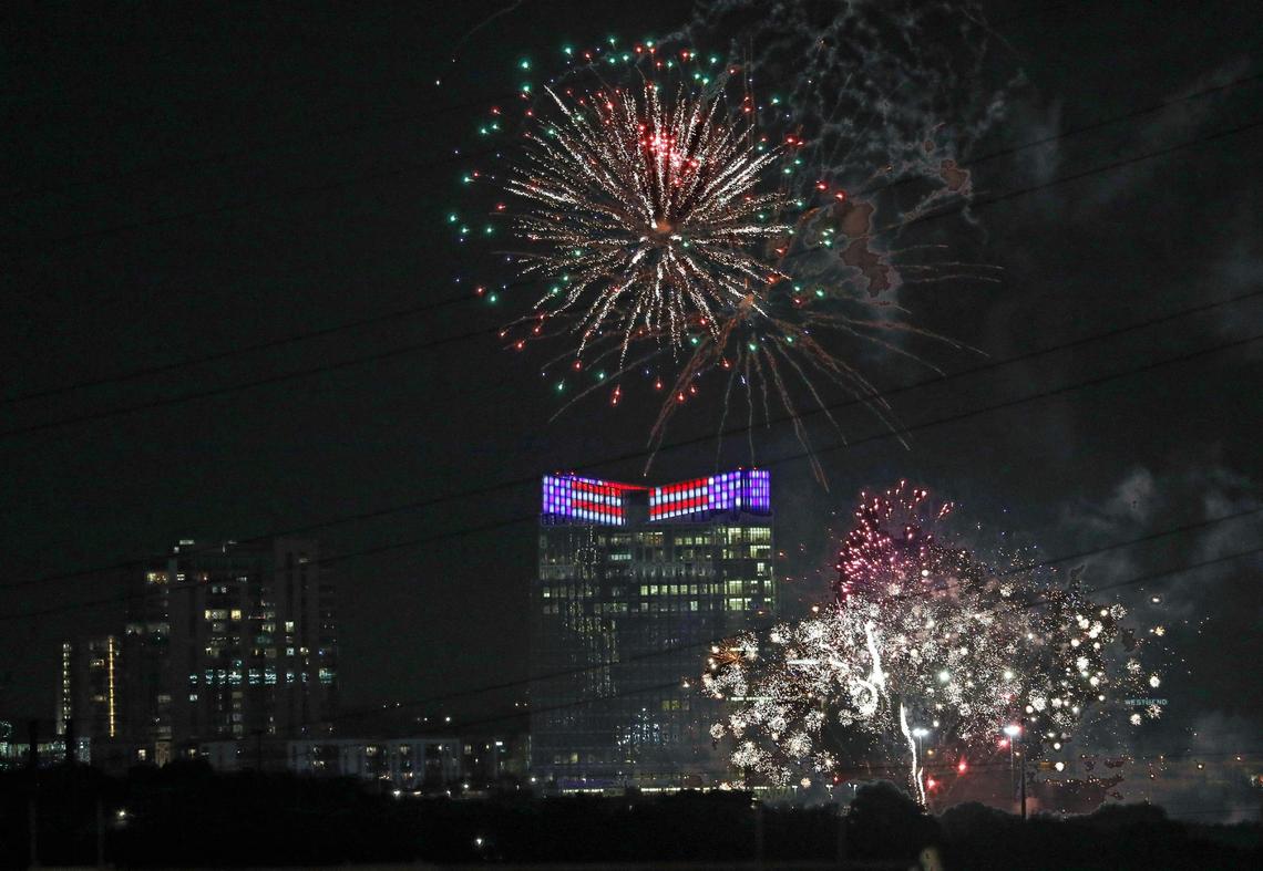 Fireworks light the night sky during the beginning moments of the Fourth of July fireworks display in Fort Worth, Texas, Monday, July 4, 2022. A few minutes in, the show was canceled due to grass fires.