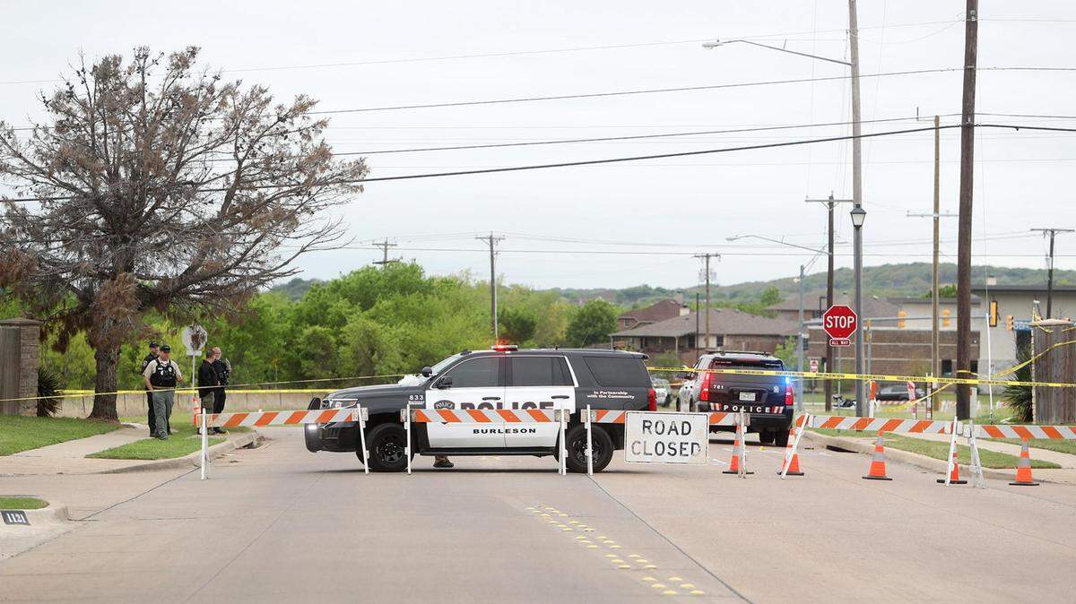 Members of the Burleson Police Department investigate the area where a police officer was shot in the 1100 block of SW Hillside Drive on April 14, 2021. Jerry Don Elders, the man accused of wounding Officer Joshua Lott and carjacking and killing Robin Waddell, is on trial this week on a capital murder charge.