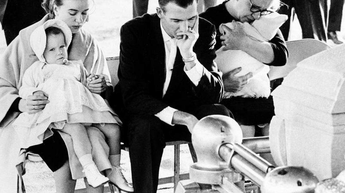 Robert Oswald, center, grieves with other members of Lee Harvey Oswald's family  at a funeral service in Fort Worth on Nov. 25, 1963. From left are Oswald's wife, Marina, holding their daughter June Lee, 22 months; Robert, his brother; and their mother, Marguerite Oswald, holding her 5-week-old grandchild Rachel.