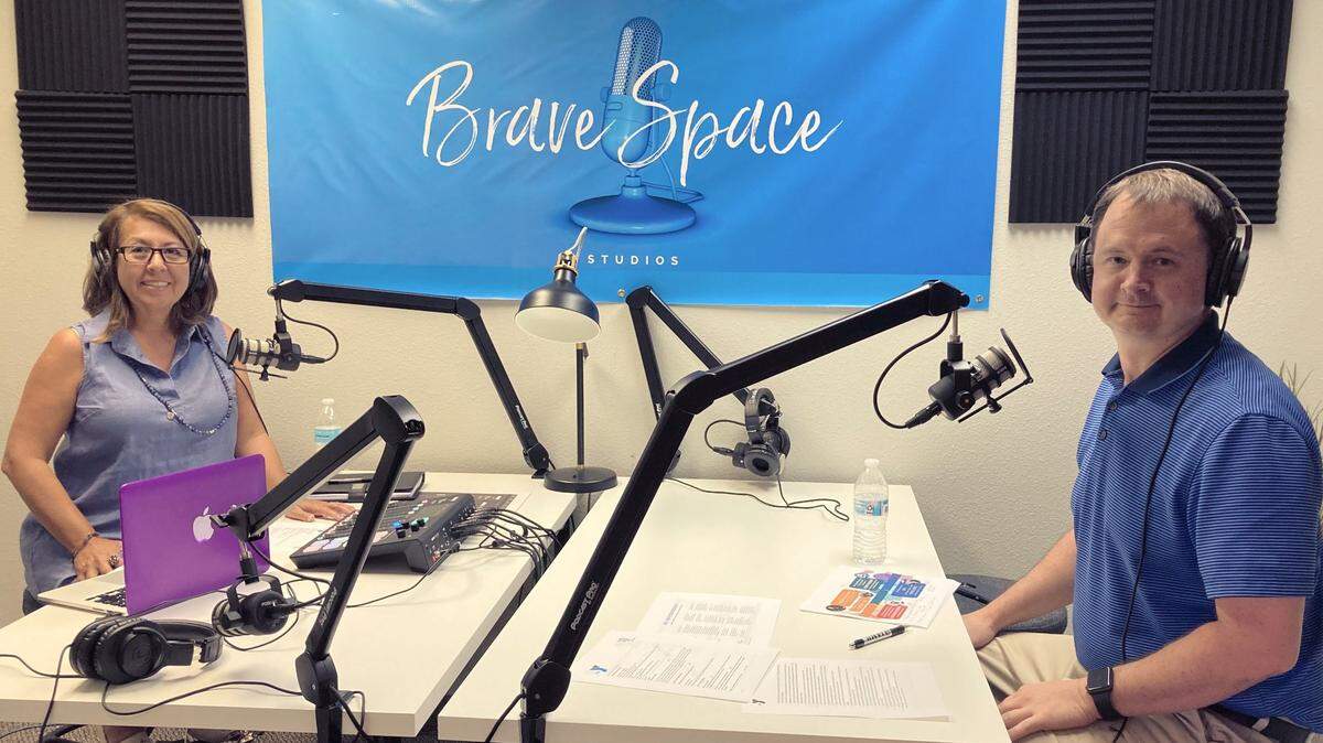 The Arlington-Mansfield YMCA’s Heidi Hardy and Eric Tucker sit in their studio while recording an episode for the Y’s Advancing Equity podcast.