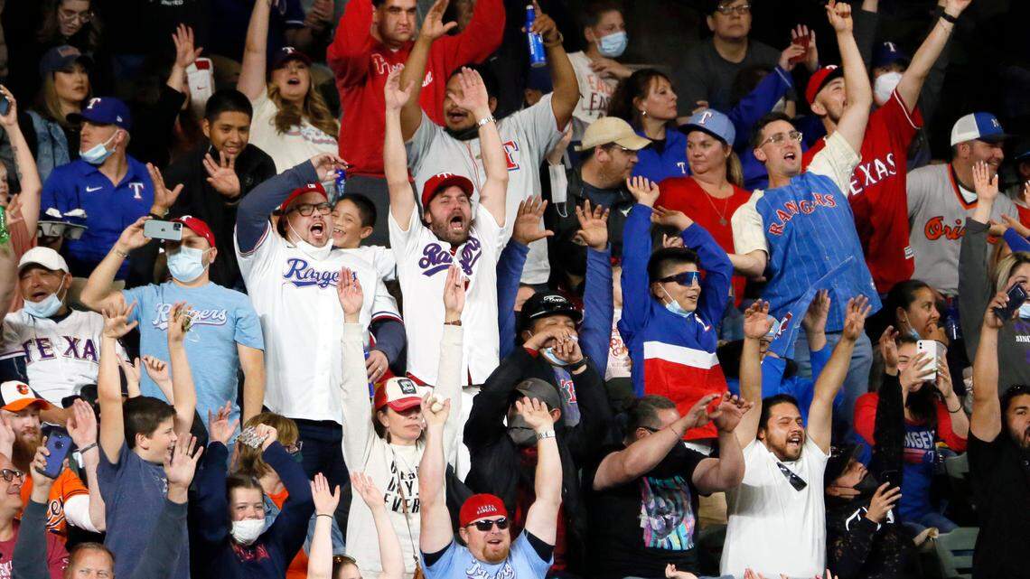 Fans at Globe Life Field do “The Wave” between innings of a baseball game between the Texas Rangers and the Baltimore Orioles in Arlington, Texas, Saturday, April 17, 2021. (AP Photo/Ray Carlin)